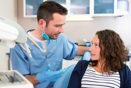 dentist explaining treatment options to dental patient